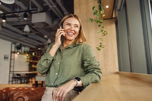 Woman smiling while talking on cellphone