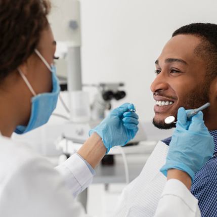 Patient in Catonsville smiling with dentist