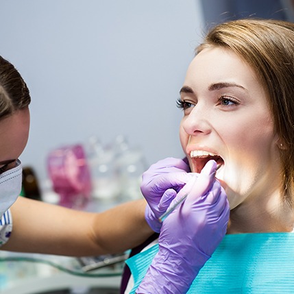 Patient in Catonsville smiling with hygienist