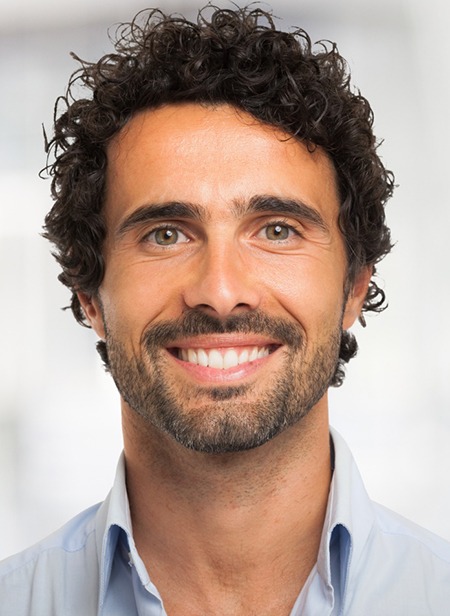Headshot of smiling man with attractive teeth