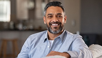 Man with dental implants smiling