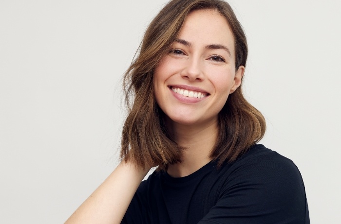 Smiling young woman in black T shirt