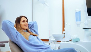 Relaxed dental patient reclining in treatment chair