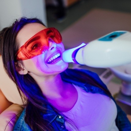 Woman getting professional teeth whitening from Catonsville cosmetic dentist